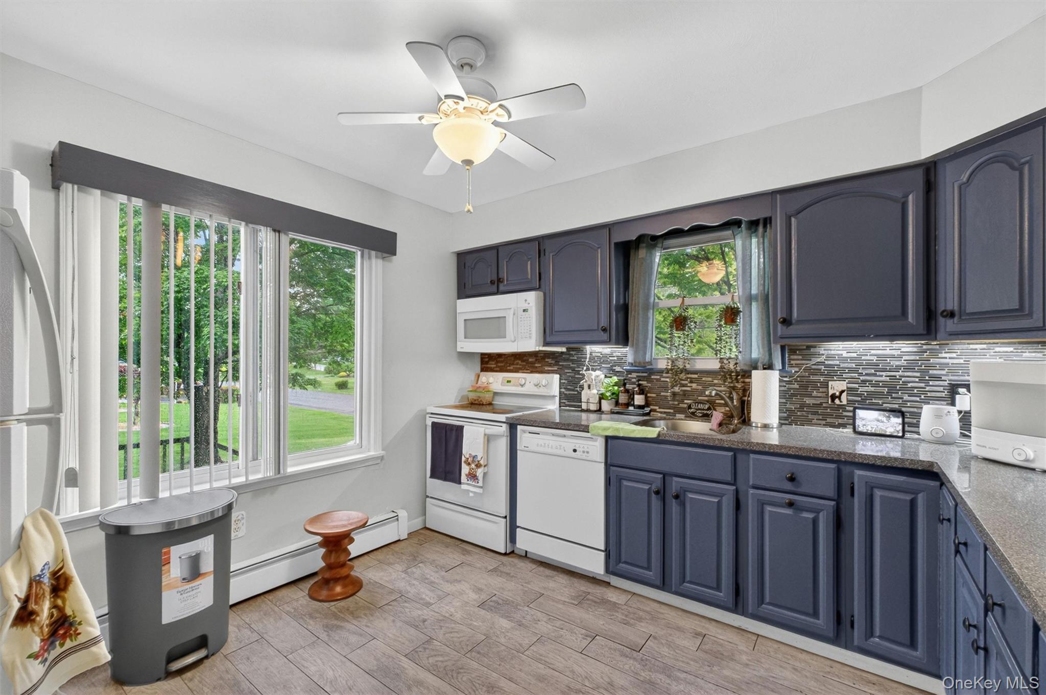 1 Merrywood Road Poughkeepsie, NY 12601 - Photo 16 of 49 a kitchen with a stove a sink and cabinets