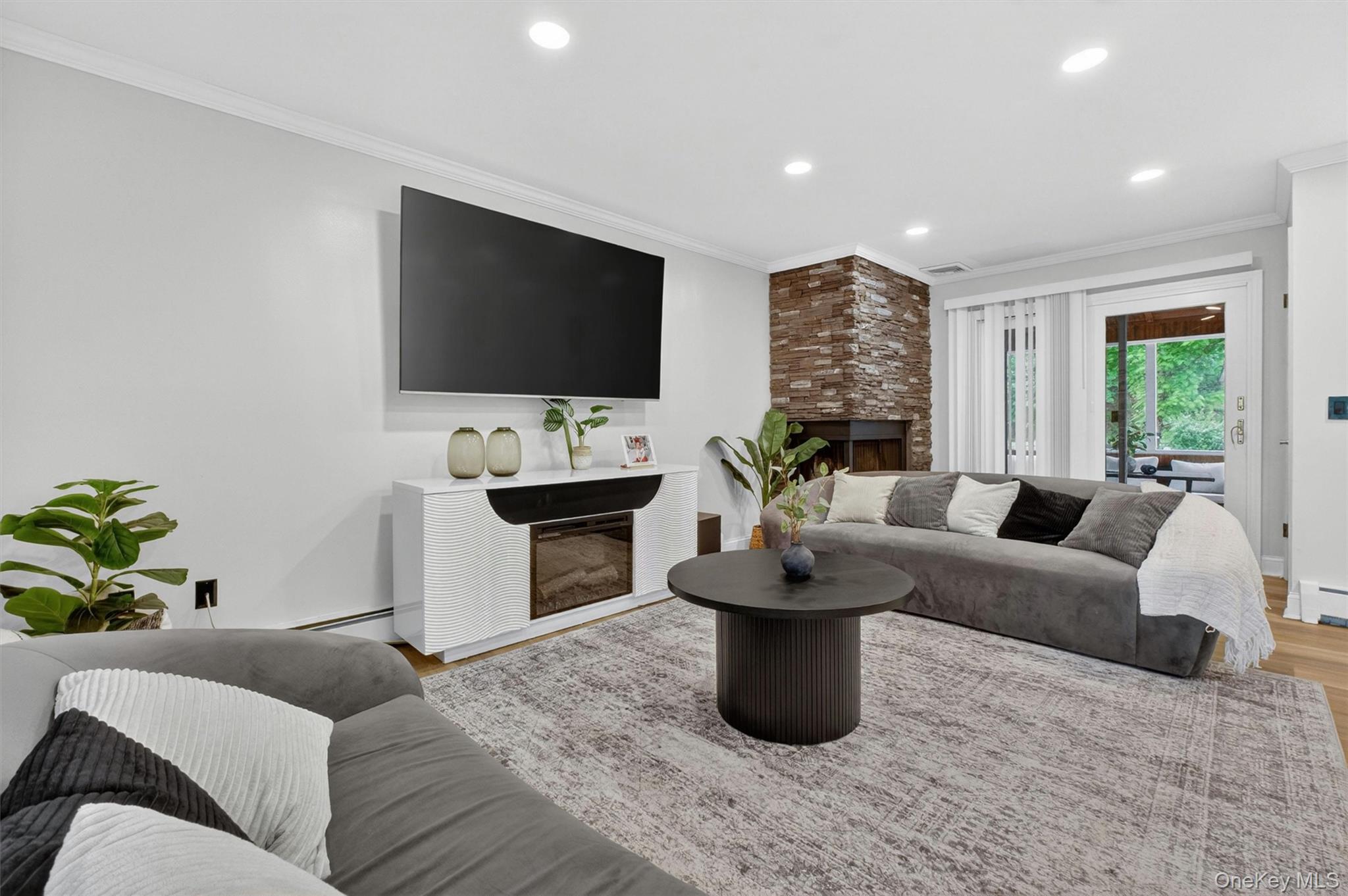 1 Merrywood Road Poughkeepsie, NY 12601 - Photo 9 of 49 a living room with furniture a flat screen tv and a fireplace