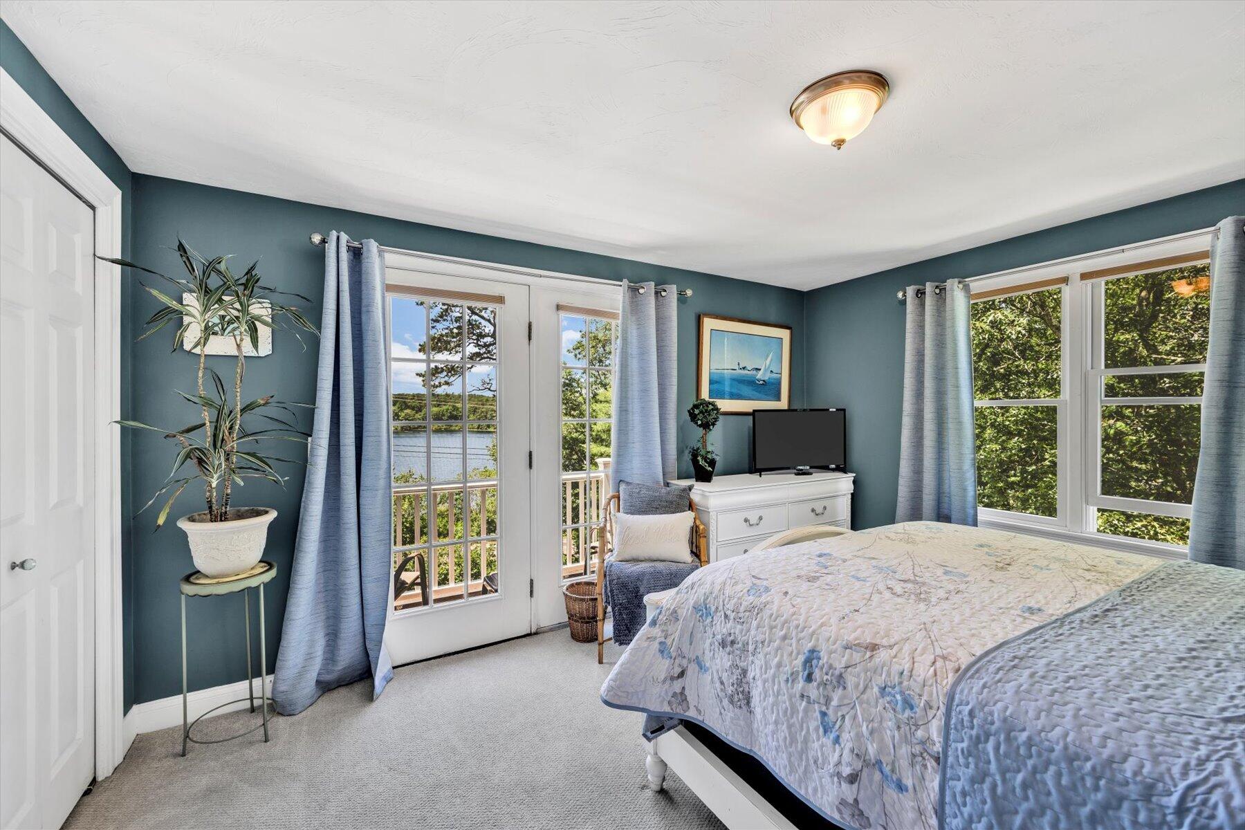 1 Ravens Nest Road Sandwich, MA 02563 - Photo 22 of 46 a bedroom with a large bed and a window