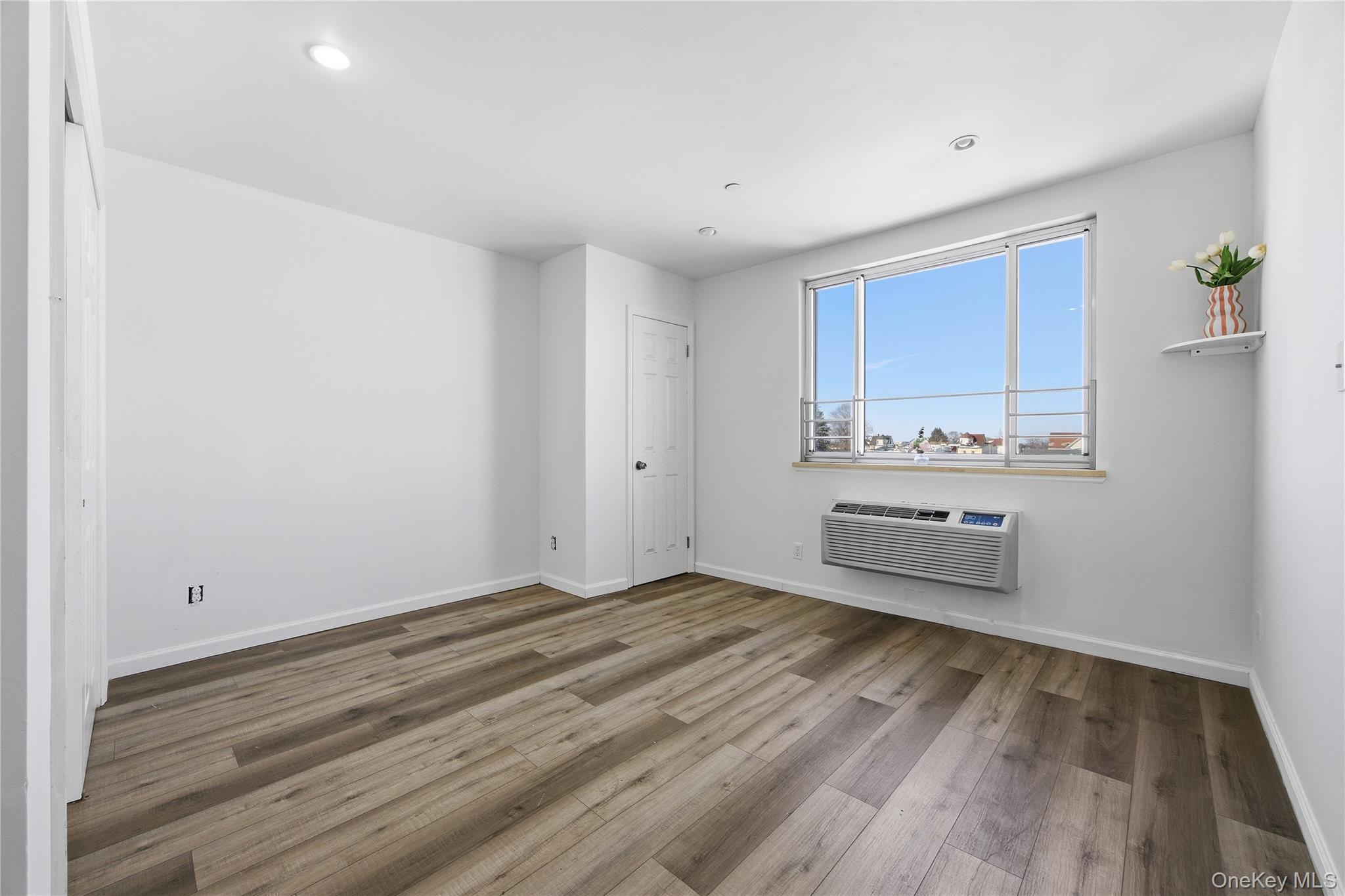 106-07 Northern Boulevard, Unit 5B Queens, NY 11368 - Photo 11 of 19 a view of kitchen and wooden floor