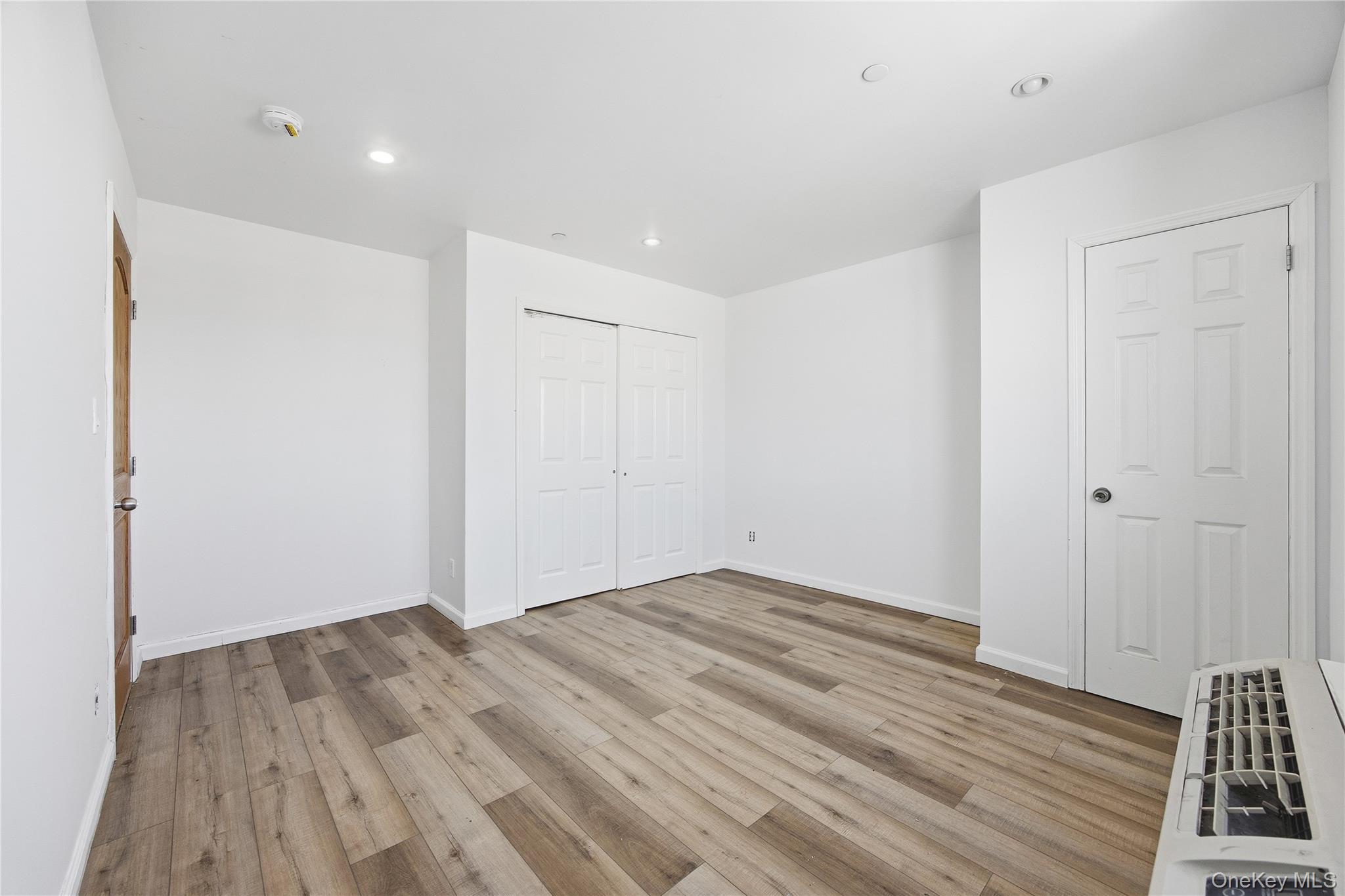 106-07 Northern Boulevard, Unit 5B Queens, NY 11368 - Photo 12 of 19 a view of room with wooden floor