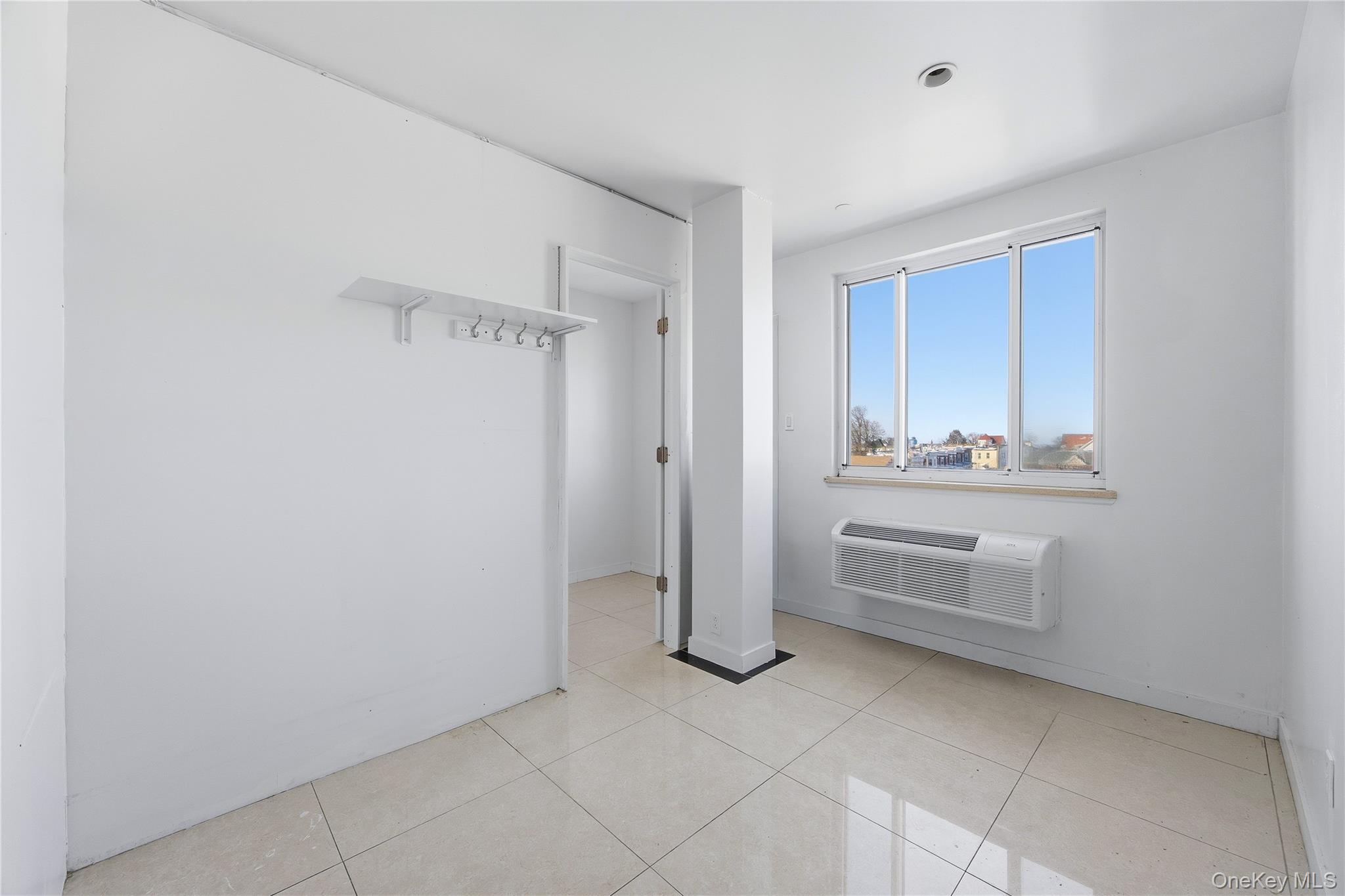 106-07 Northern Boulevard, Unit 5B Queens, NY 11368 - Photo 13 of 19 a view of cabinets and window