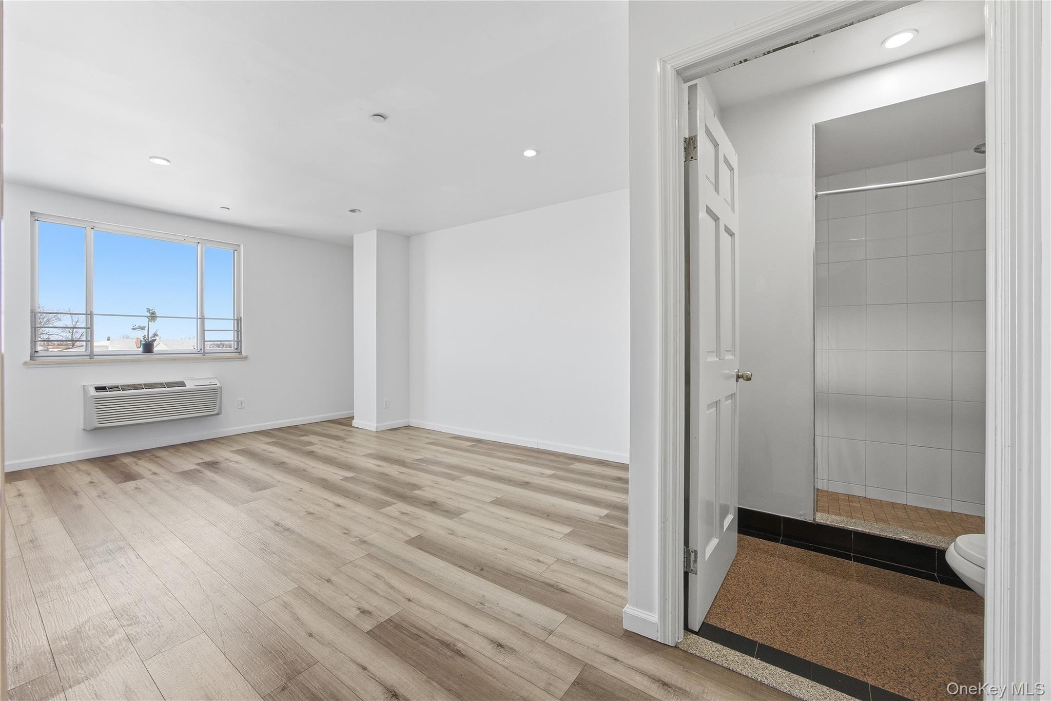 106-07 Northern Boulevard, Unit 5B Queens, NY 11368 - Photo 5 of 19 a view of a kitchen from the hallway