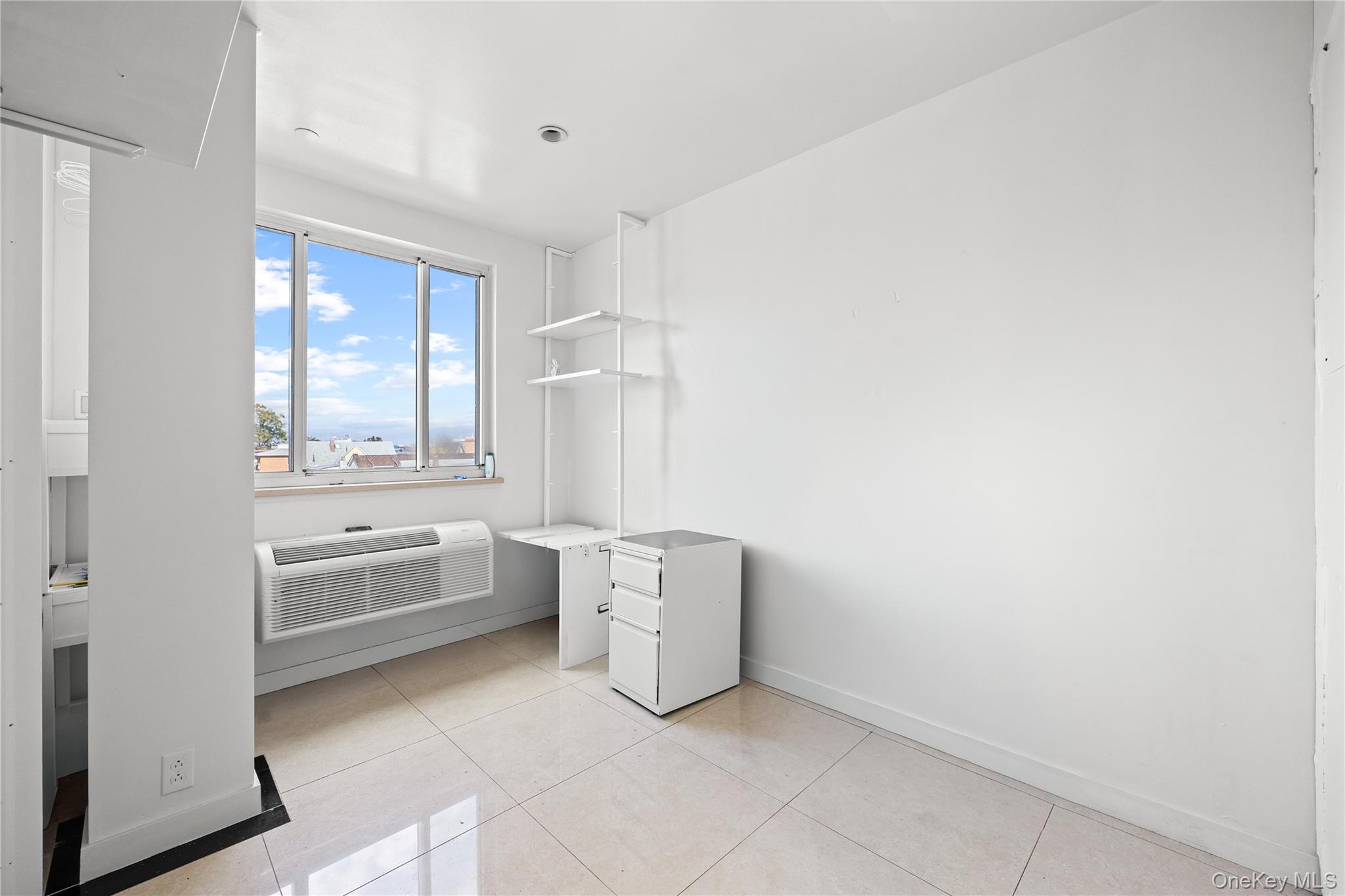 106-07 Northern Boulevard, Unit 5B Queens, NY 11368 - Photo 6 of 18 a room with dryer and washer