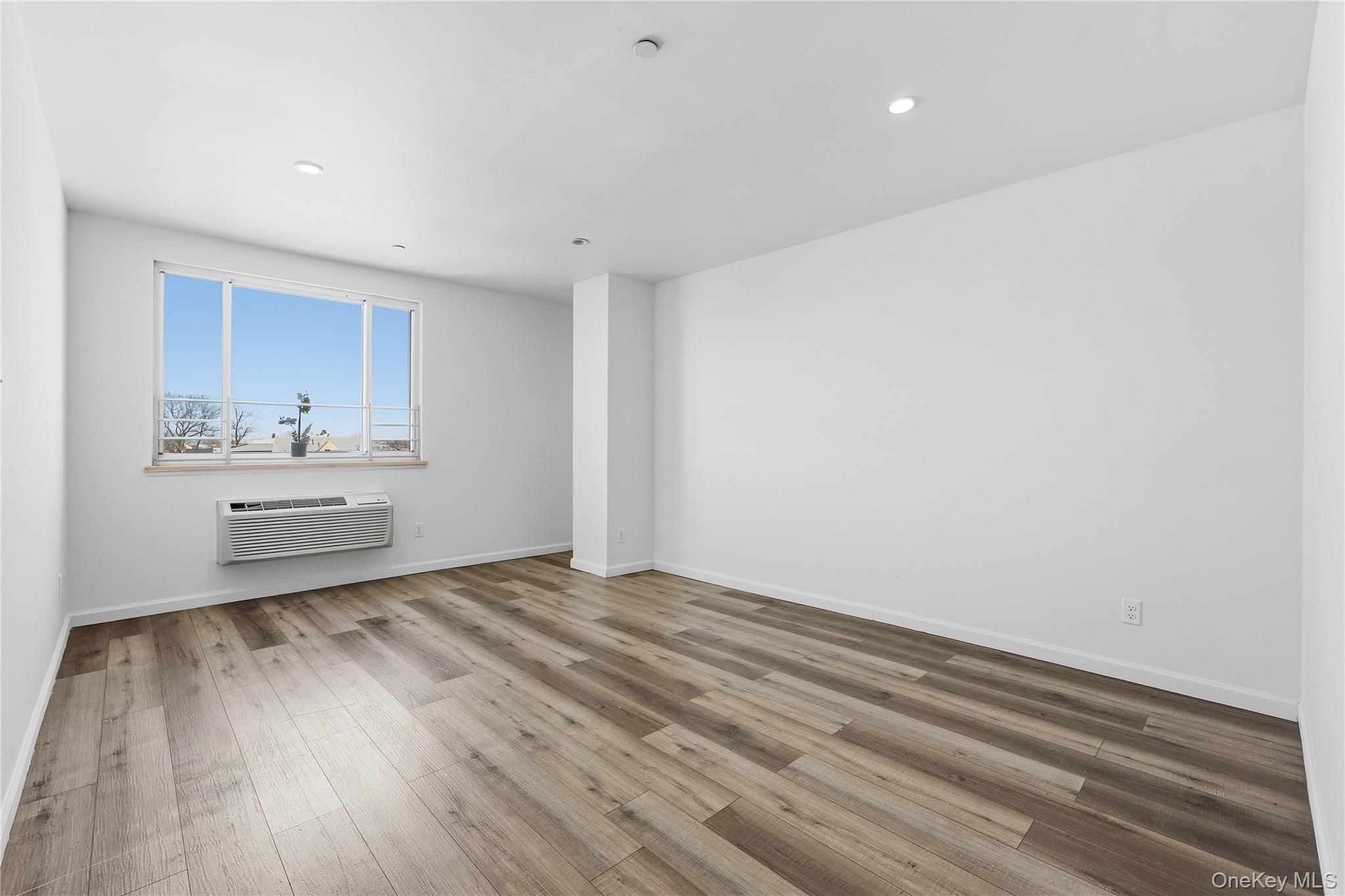 106-07 Northern Boulevard, Unit 5B Queens, NY 11368 - Photo 7 of 19 a view of a kitchen with wooden floor
