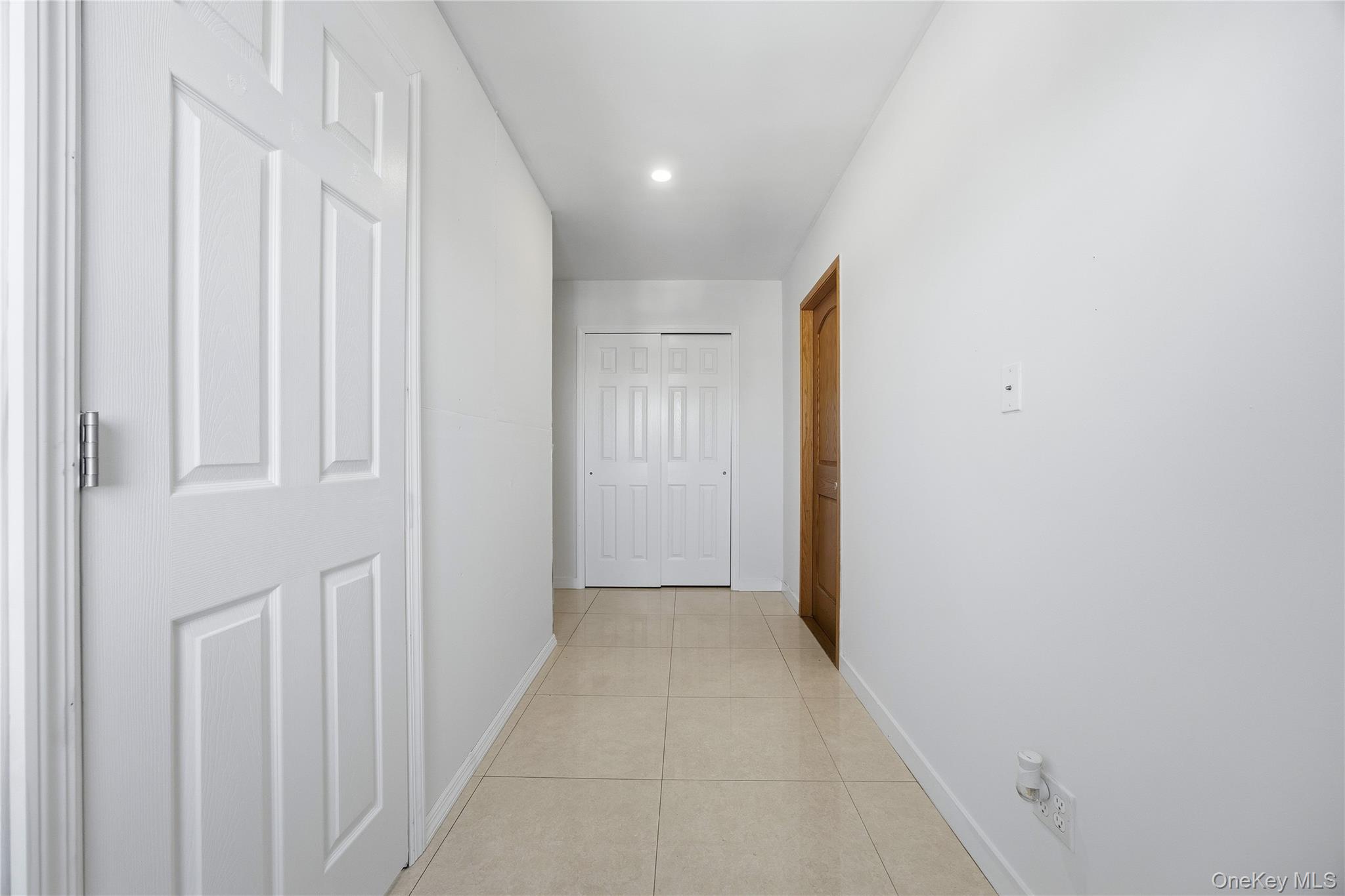 106-07 Northern Boulevard, Unit 5B Queens, NY 11368 - Photo 10 of 19 a view of a hallway with wooden floor