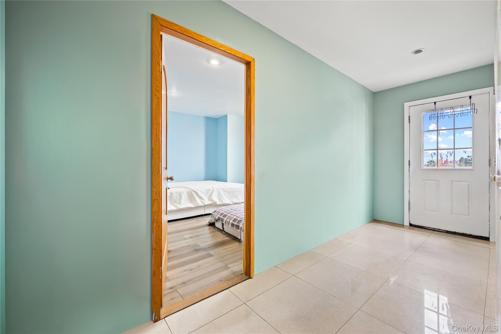 106-07 Northern Boulevard, Unit 5B Queens, NY 11368 - Photo 10 of 18 a view of a bathroom from the hallway