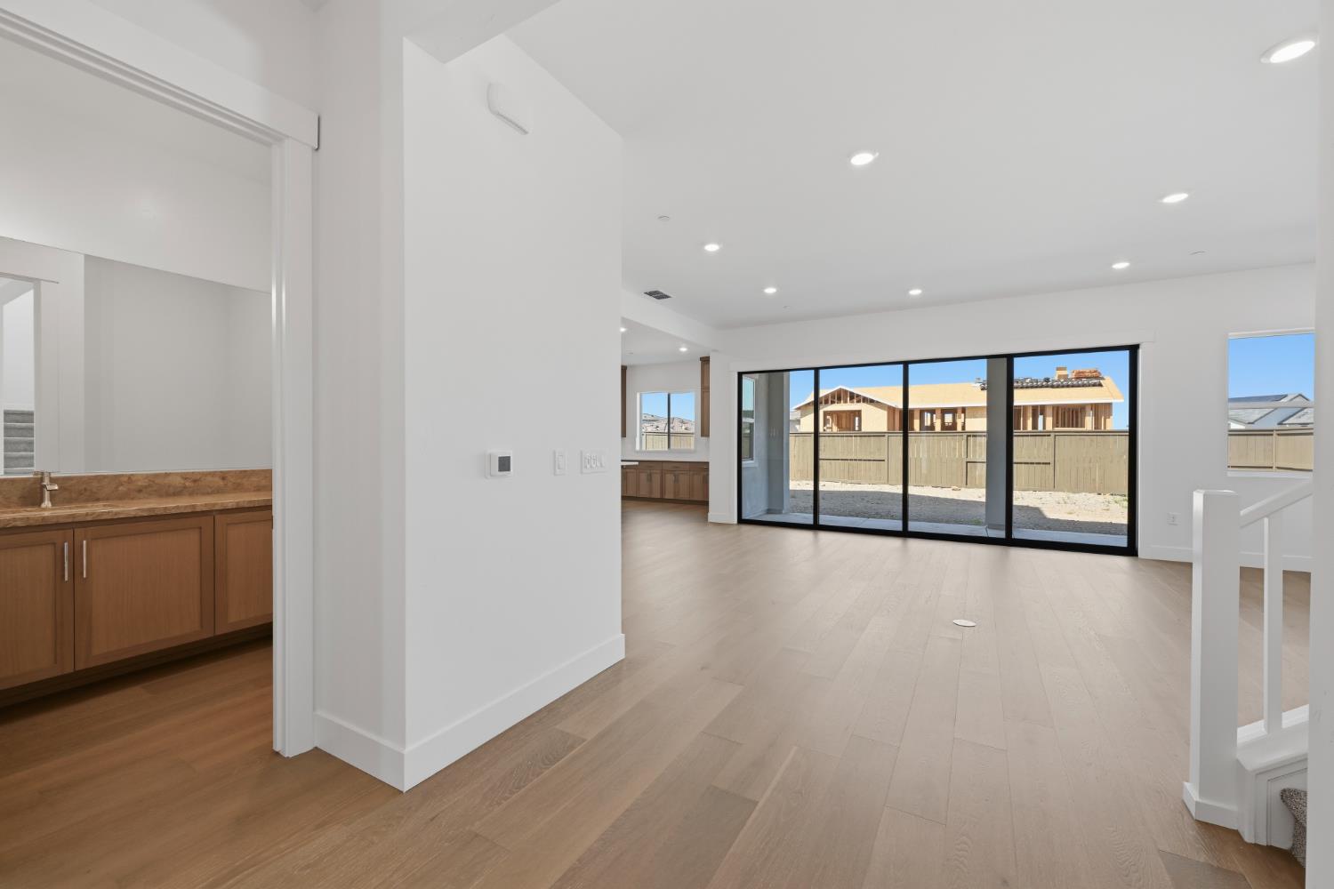 751 Bandera Drive Rocklin, CA 95765 - Photo 13 of 23 a view of an empty room with a window and wooden floor