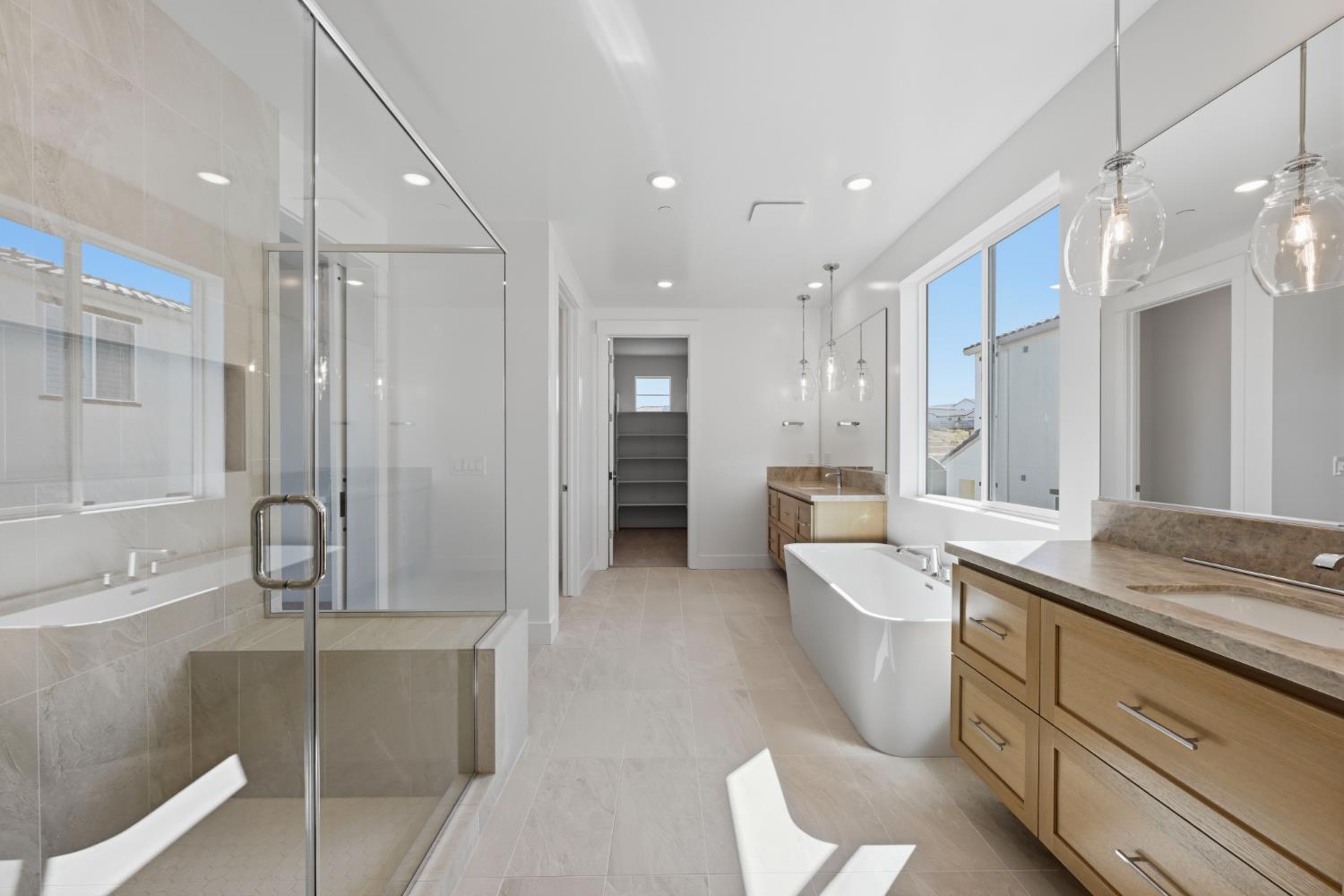 751 Bandera Drive Rocklin, CA 95765 - Photo 20 of 23 a large bathroom with a double vanity sink a large mirror and a shower