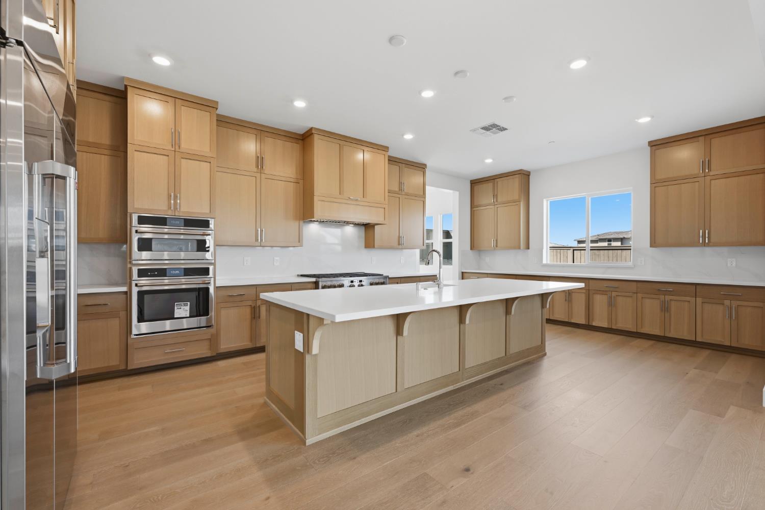 751 Bandera Drive Rocklin, CA 95765 - Photo 2 of 23 a large kitchen with stainless steel appliances a large counter top a stove a sink and a refrigerator