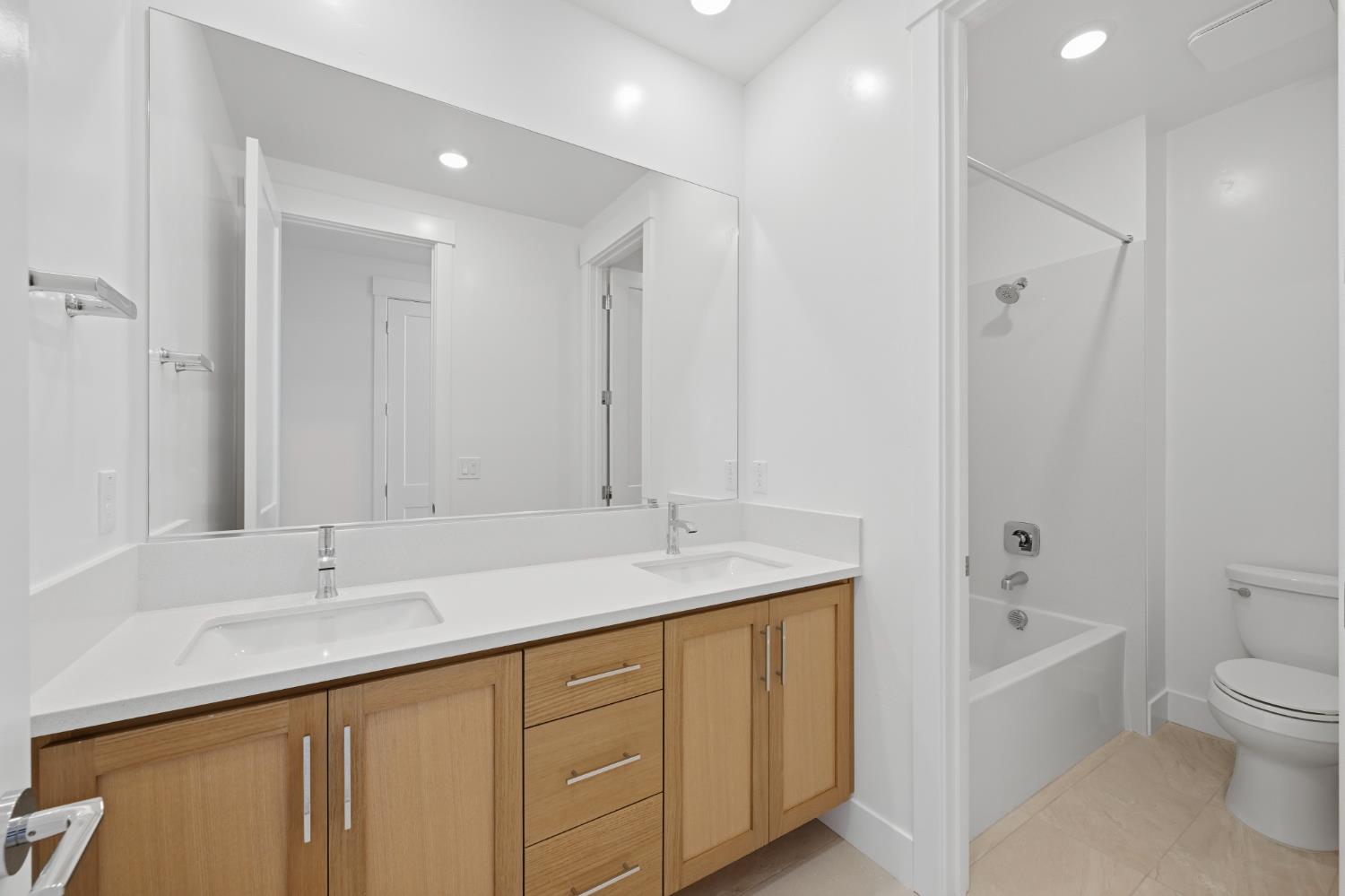 751 Bandera Drive Rocklin, CA 95765 - Photo 23 of 23 a bathroom with a granite countertop sink a toilet and shower
