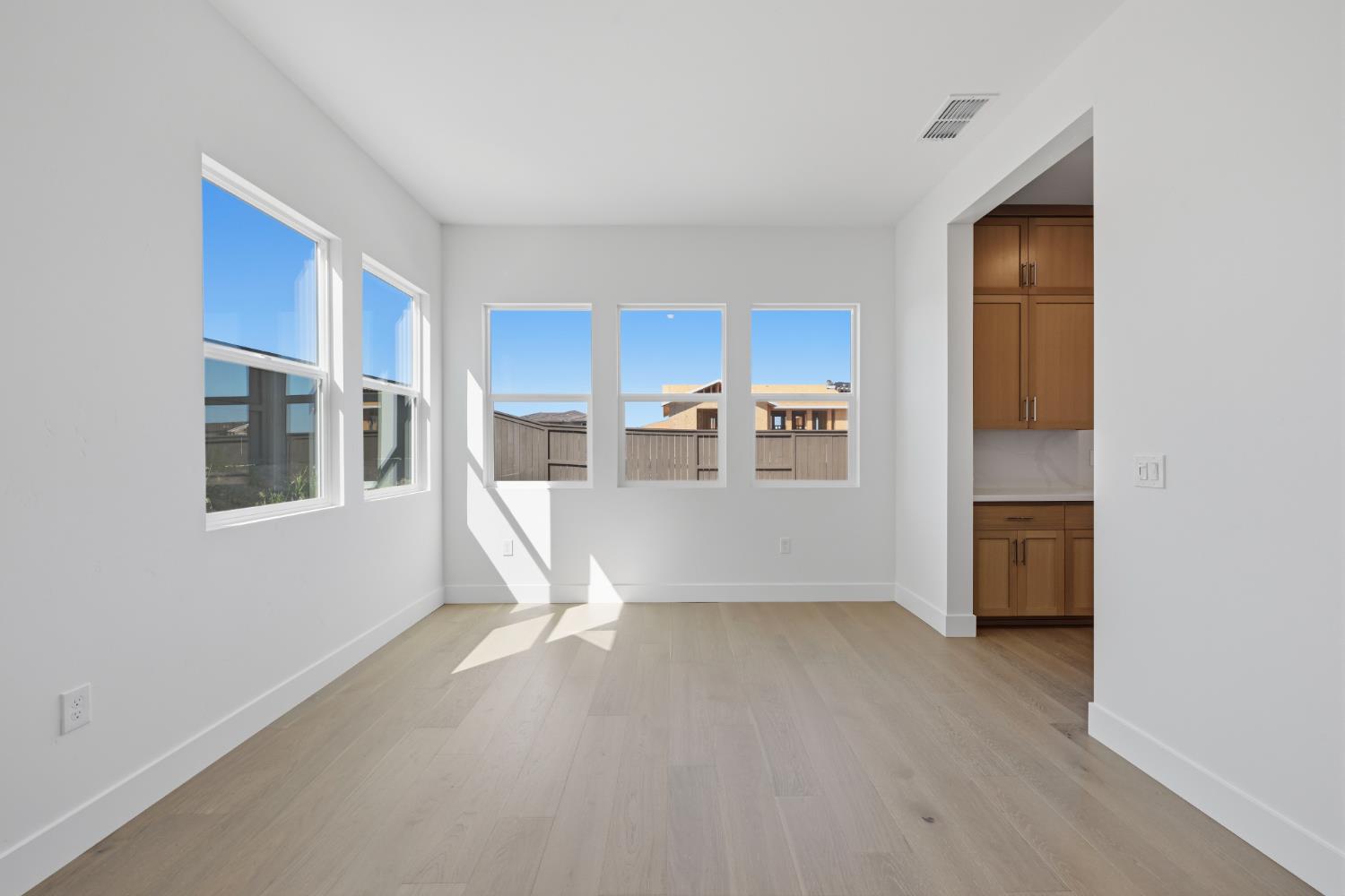 751 Bandera Drive Rocklin, CA 95765 - Photo 5 of 23 a view of workspace with kitchen island wooden floor and window