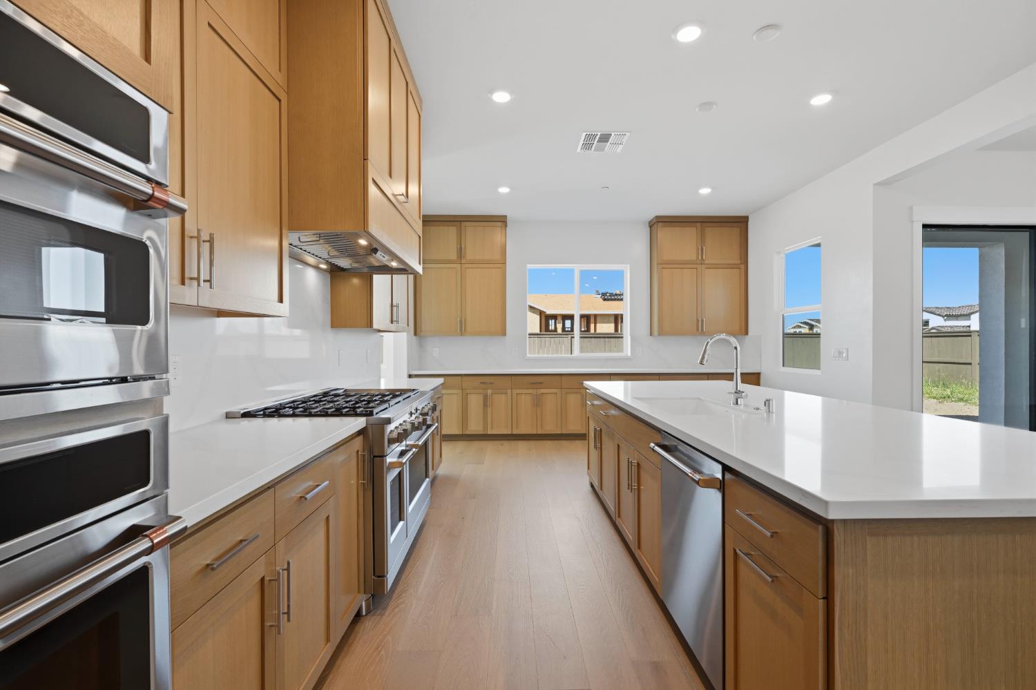 751 Bandera Drive Rocklin, CA 95765 - Photo 6 of 23 a kitchen with stainless steel appliances granite countertop a sink a stove and a refrigerator