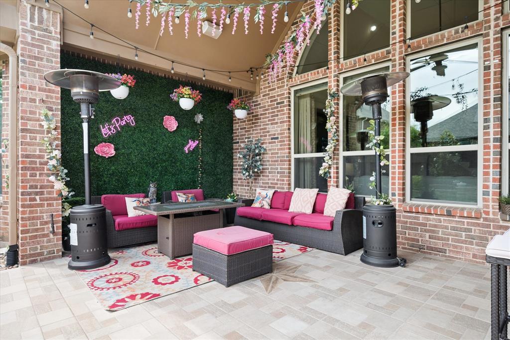 8268 Kara Creek Road Frisco, TX 75036 - Photo 26 of 31 Covered patio featuring brick columns, a brick exterior wall, and tall windows