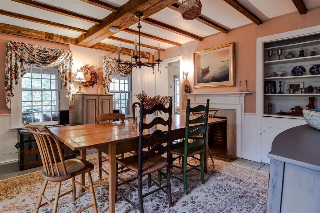 86 Fowler Street Upton, MA 01568 - Photo 11 of 42 a dining room with a wooden table and chairs