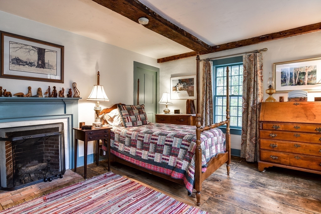 86 Fowler Street Upton, MA 01568 - Photo 16 of 42 a bedroom with a bed and wooden floor