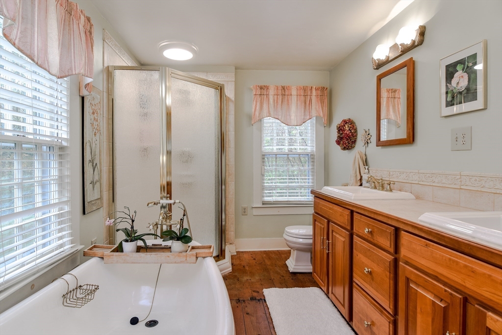 86 Fowler Street Upton, MA 01568 - Photo 20 of 42 a bathroom with a sink double vanity and a tub
