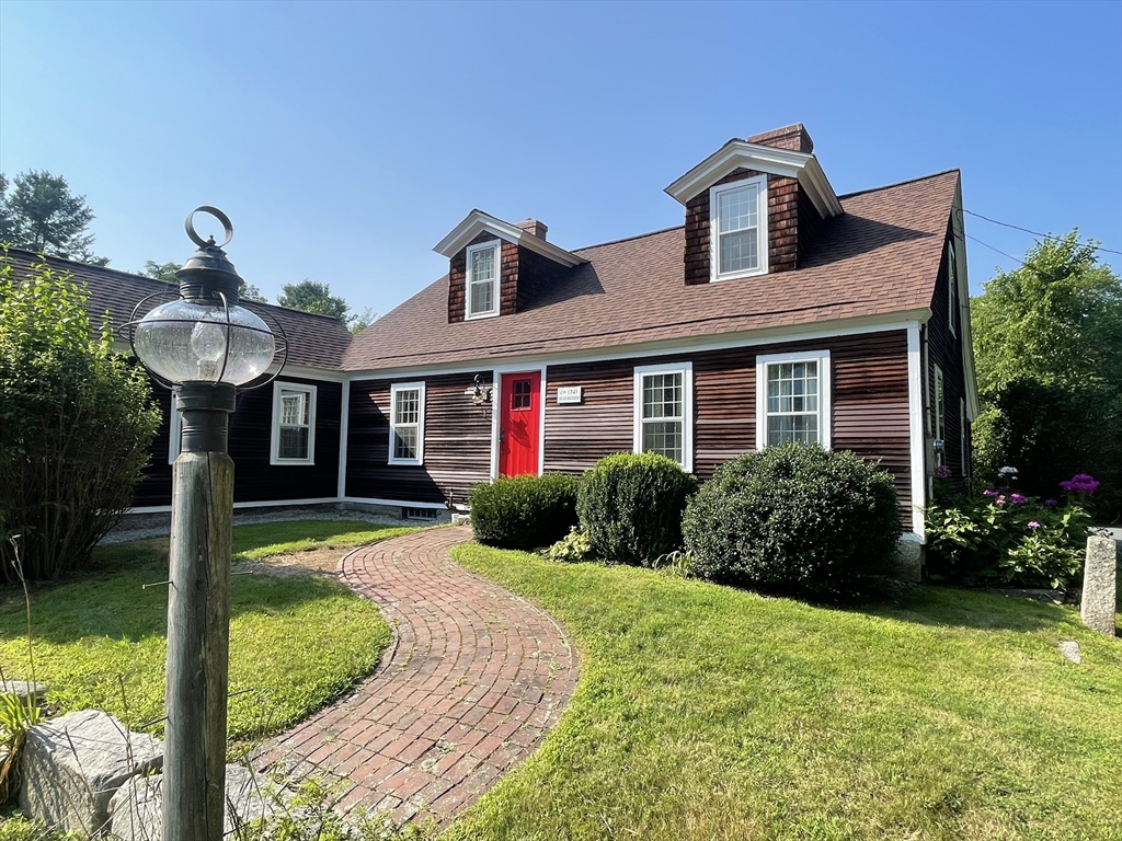 86 Fowler Street Upton, MA 01568 - Photo 2 of 42 a front view of a house with garden and porch
