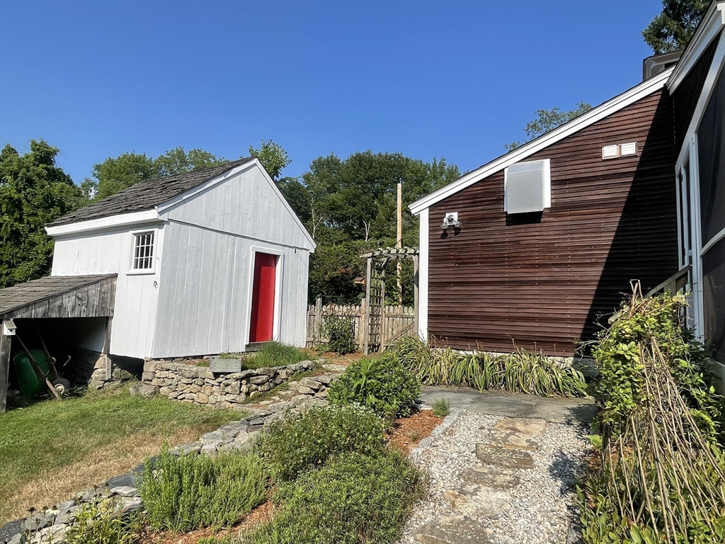86 Fowler Street Upton, MA 01568 - Photo 30 of 42 a view of a house with backyard and garden
