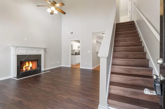 a view of an empty room and wooden floor