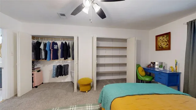 a bathroom with a granite countertop sink a mirror and a toilet