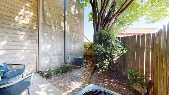 a view of a patio with a table and chairs and couches
