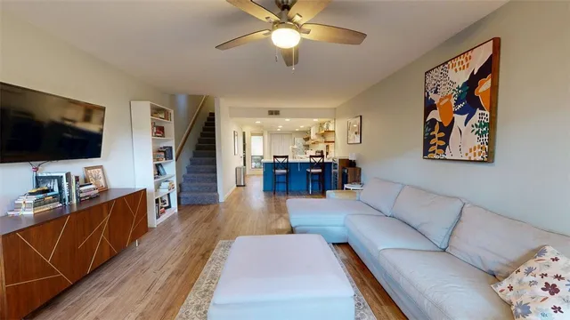 a kitchen with a sink window and cabinets