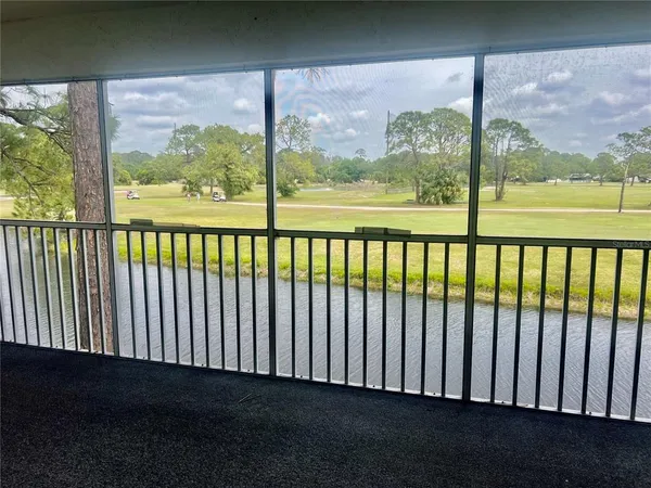 a view of a balcony with a floor to ceiling window
