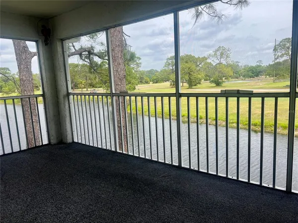 an empty room with sliding glass door