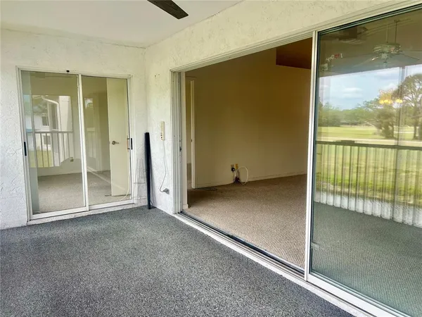 a terrace with outdoor seating and city view