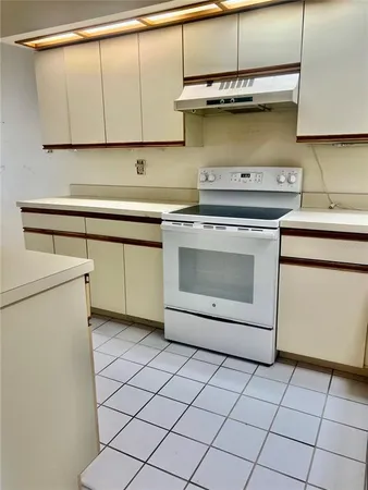 a kitchen with a stove and a sink