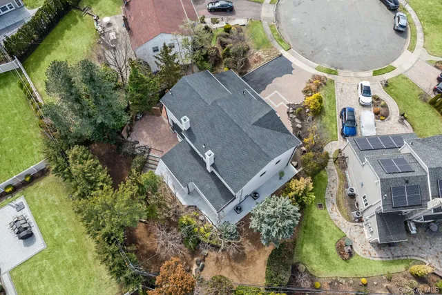 an aerial view of a house with outdoor space