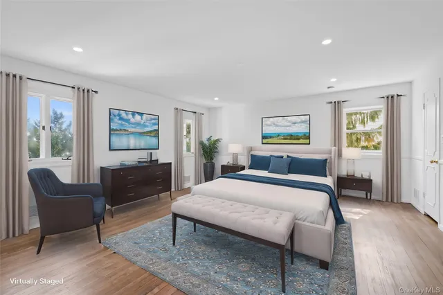 a bedroom with a bed a couch and dresser