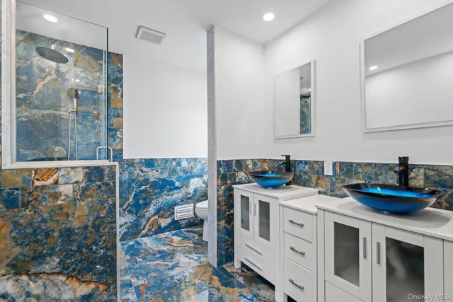 a kitchen with stainless steel appliances a stove and a sink