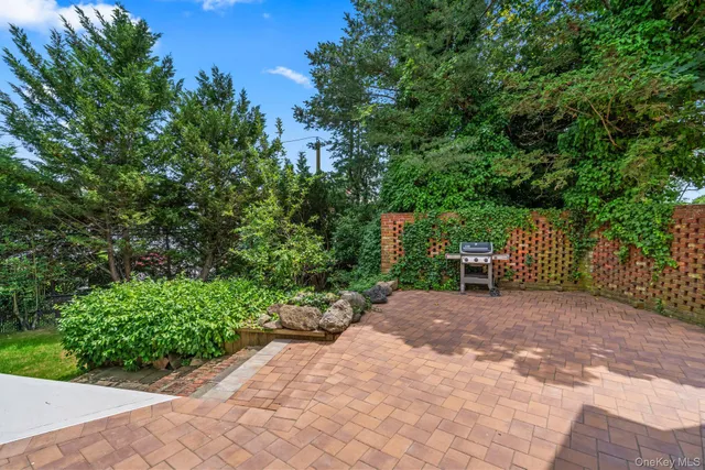 a wooden bench with view of trees