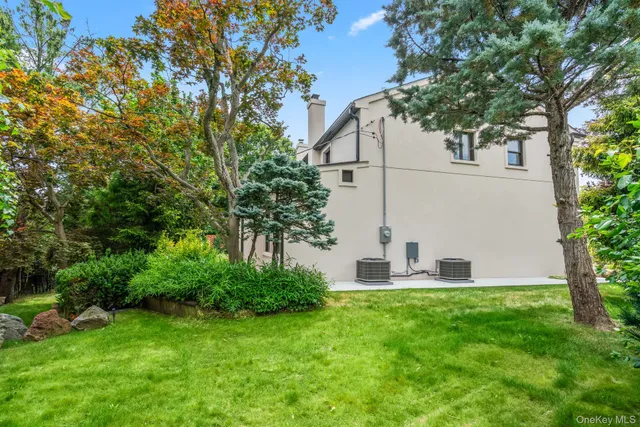 a view of house with backyard