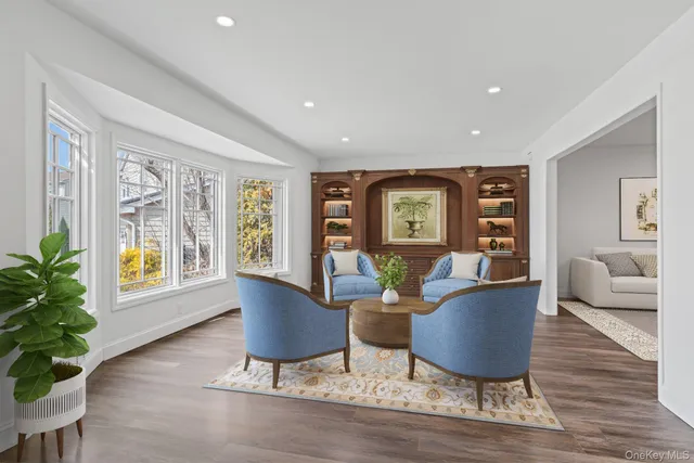 a living room with furniture and a potted plant