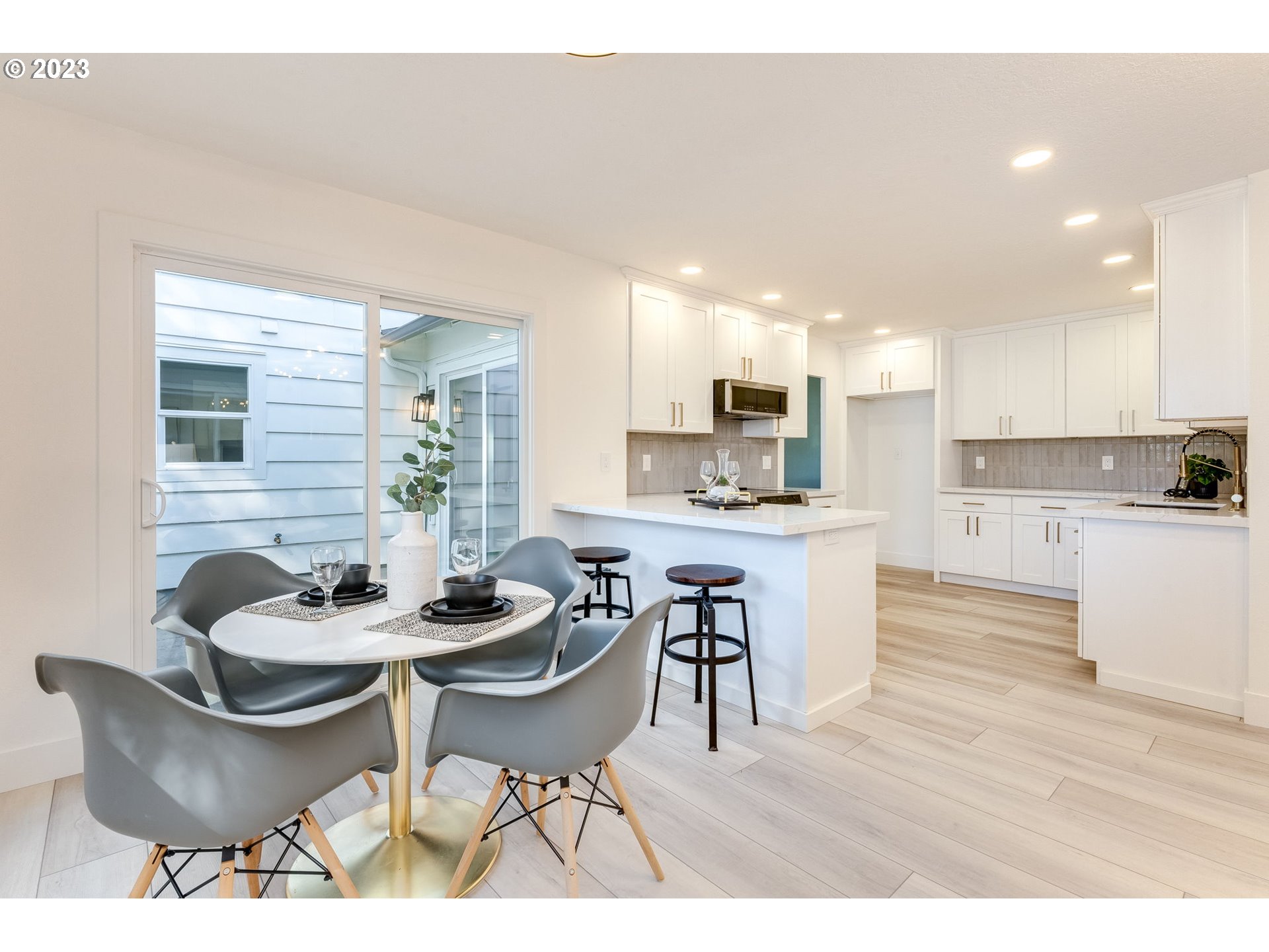 3842 North Alaska Street Portland, OR 97217 - Photo 12 of 36 a kitchen with a table and chairs in it