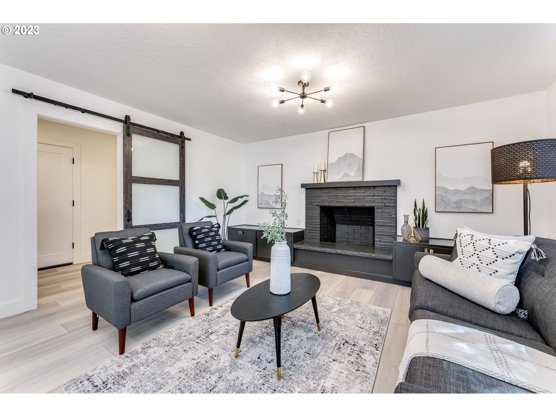 3842 North Alaska Street Portland, OR 97217 - Photo 14 of 36 a living room with furniture and a fireplace
