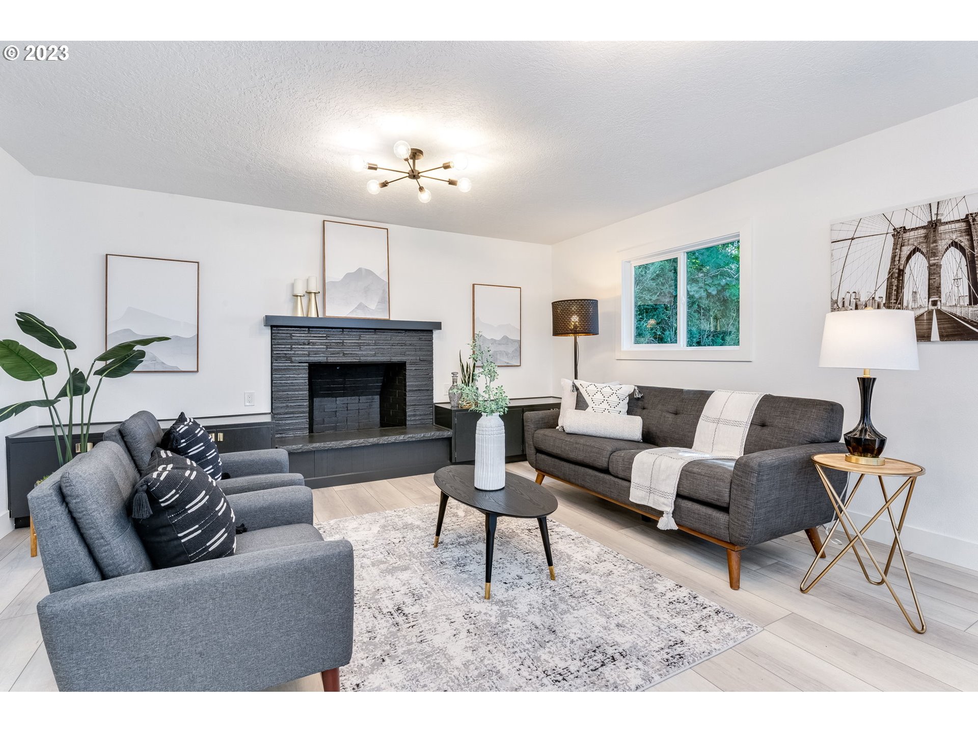 3842 North Alaska Street Portland, OR 97217 - Photo 15 of 36 a living room with furniture and a fireplace