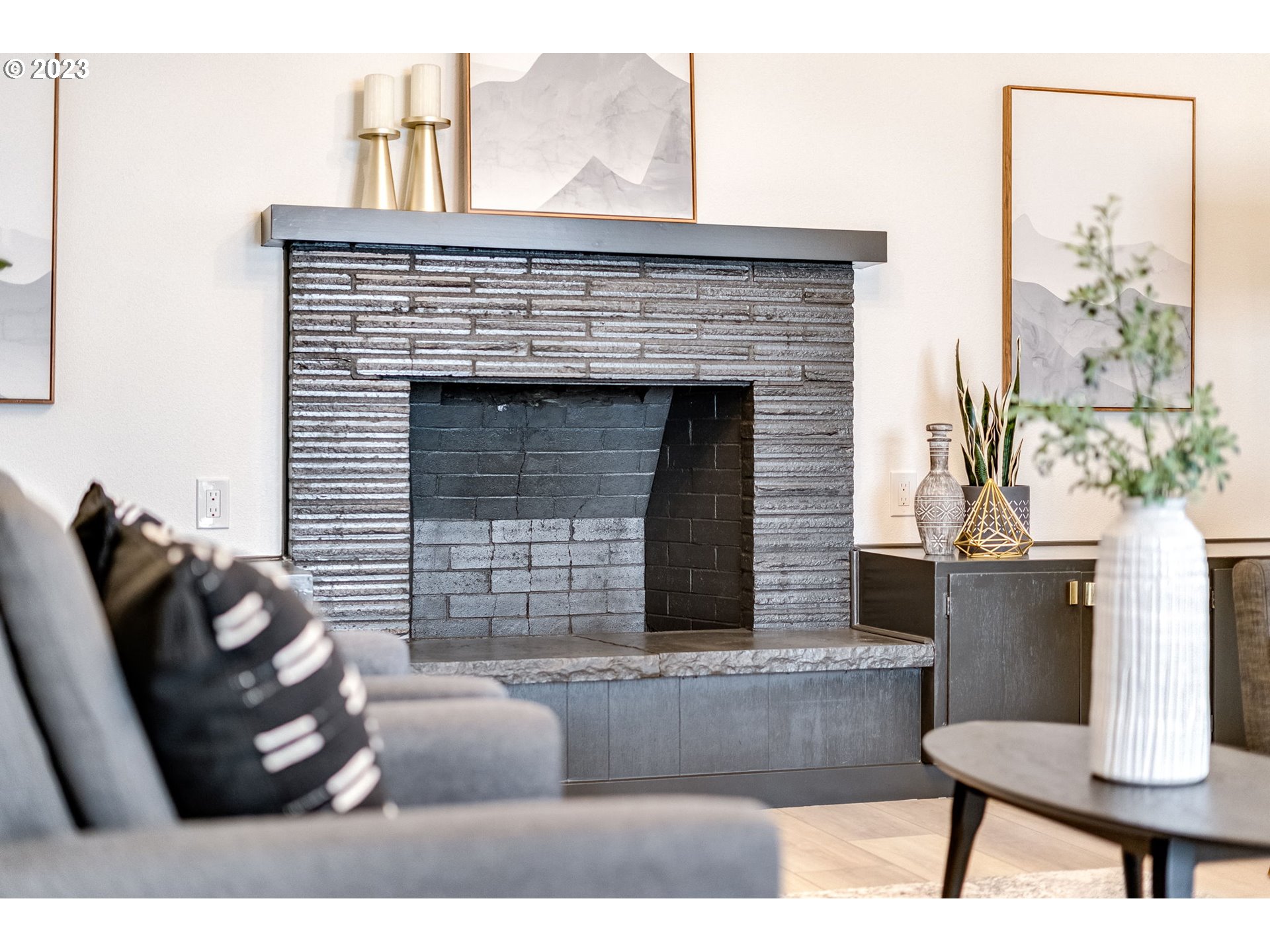 3842 North Alaska Street Portland, OR 97217 - Photo 17 of 36 a living room with furniture and a fireplace