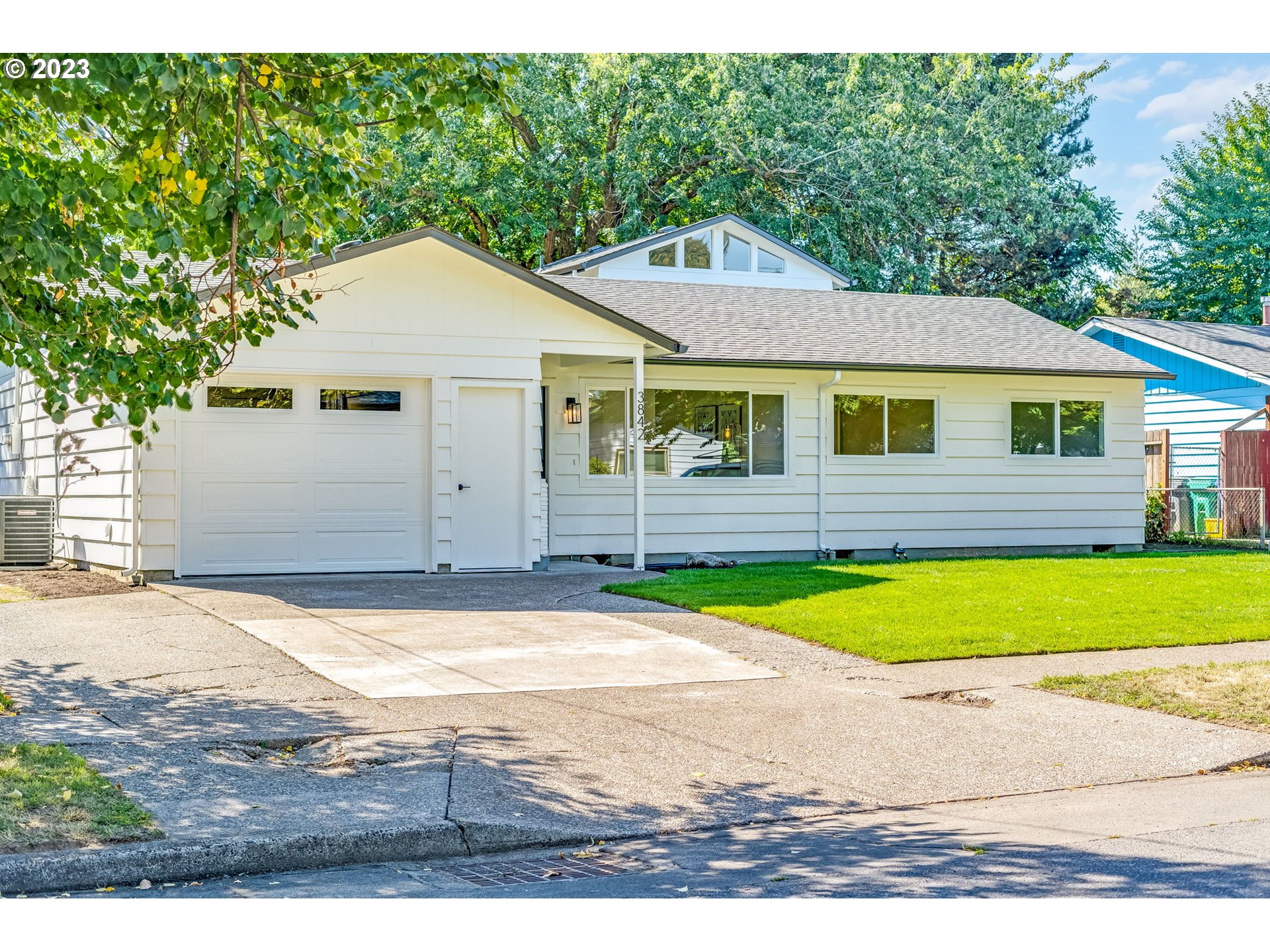 3842 North Alaska Street Portland, OR 97217 - Photo 2 of 36 a view of a yard in front of a house with large trees