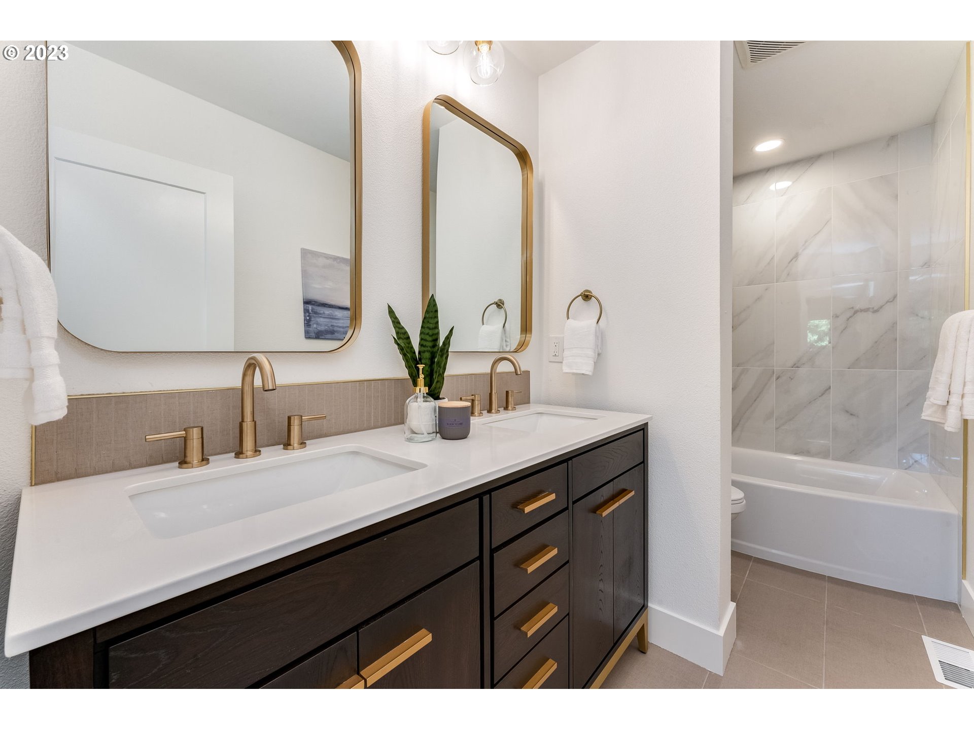 3842 North Alaska Street Portland, OR 97217 - Photo 21 of 36 a bathroom with a sink double vanity granite tub shower and a mirror