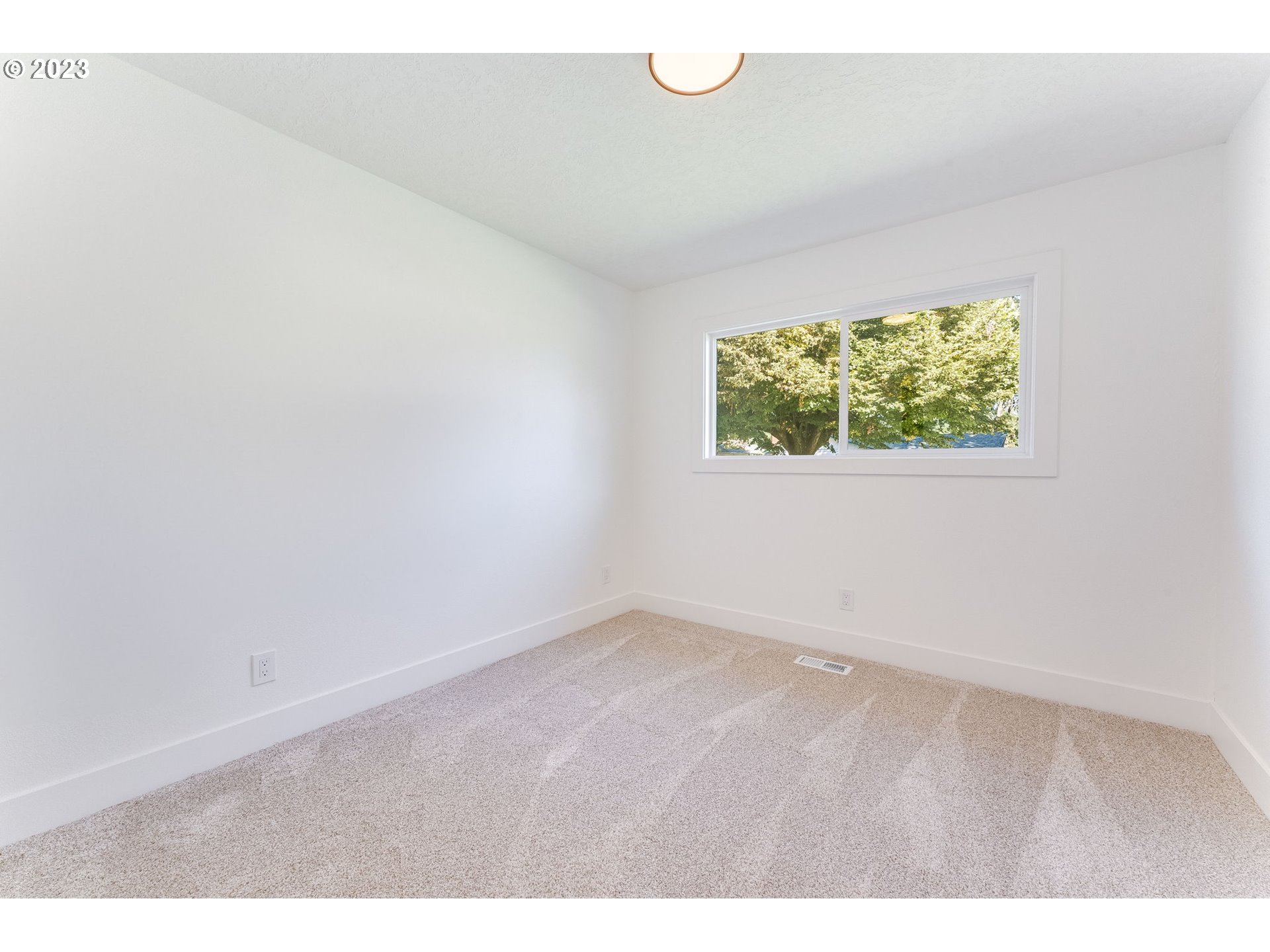3842 North Alaska Street Portland, OR 97217 - Photo 24 of 36 an empty room with a window