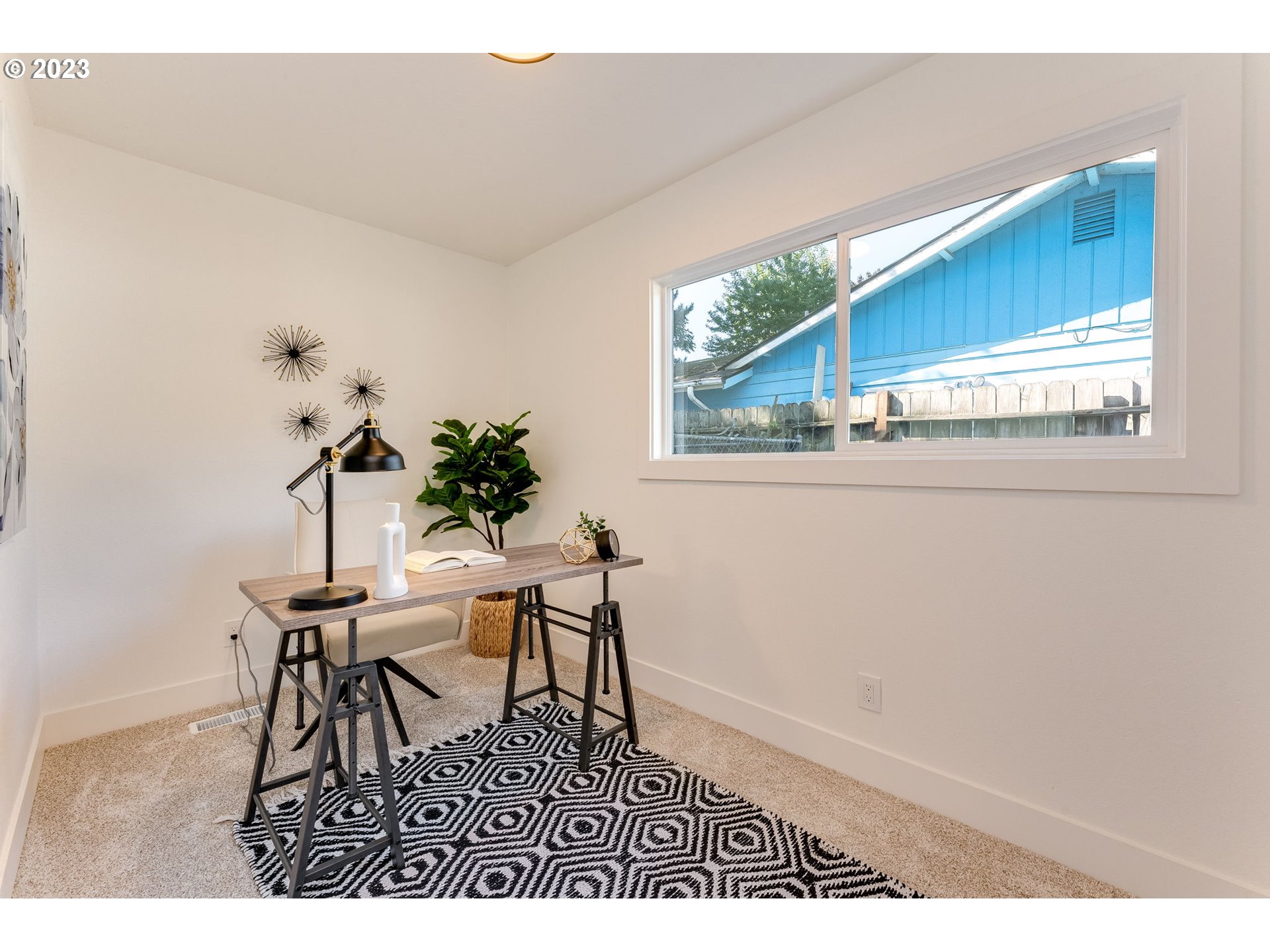 3842 North Alaska Street Portland, OR 97217 - Photo 26 of 36 a view of a dining room with furniture and a window