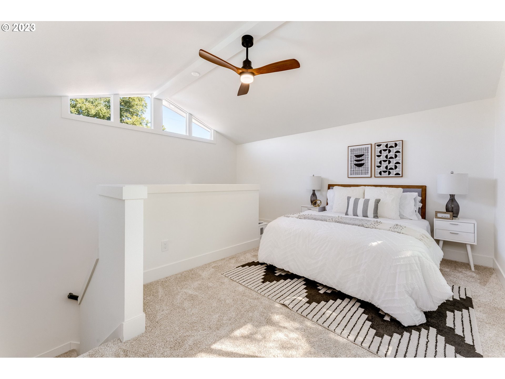 3842 North Alaska Street Portland, OR 97217 - Photo 28 of 36 a bedroom with a bed and a ceiling fan