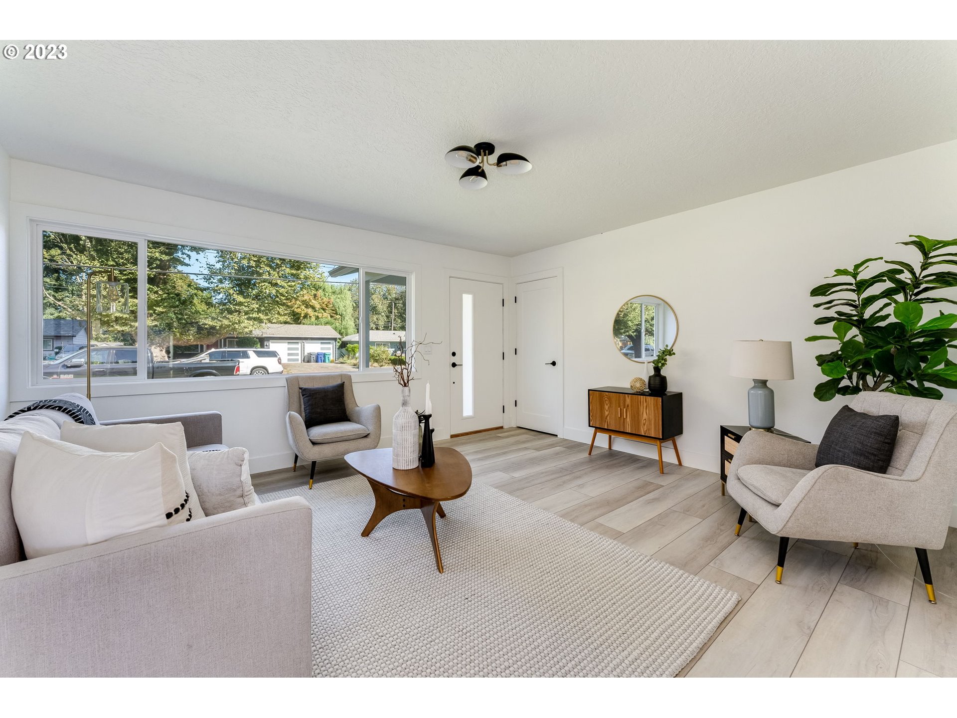 3842 North Alaska Street Portland, OR 97217 - Photo 5 of 36 a living room with furniture and a large window