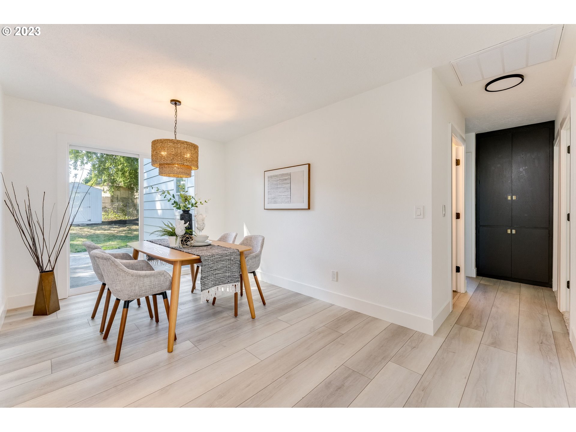 3842 North Alaska Street Portland, OR 97217 - Photo 8 of 36 a view of a dining room with furniture and wooden floor