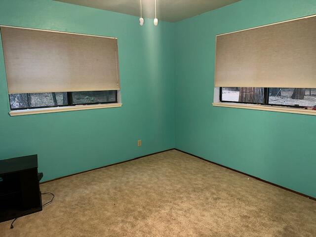 7722 Hidden Meadows Road Shingletown, CA 96088 - Photo 7 of 12 a view of a room with a ceiling fan and wooden floor