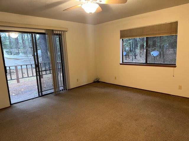 7722 Hidden Meadows Road Shingletown, CA 96088 - Photo 9 of 12 an empty room with windows